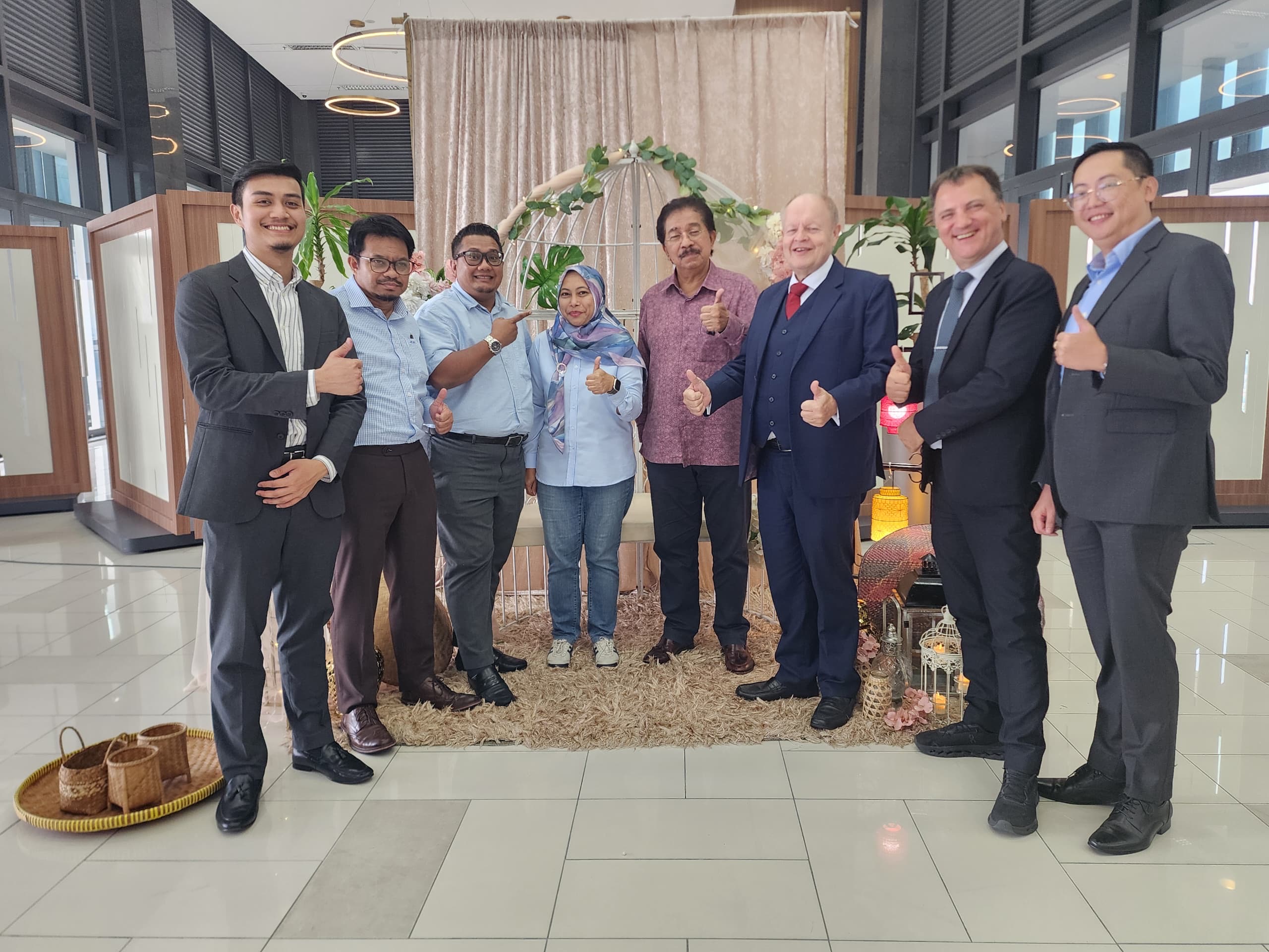 RIDC team members welcoming guests with a handshake.